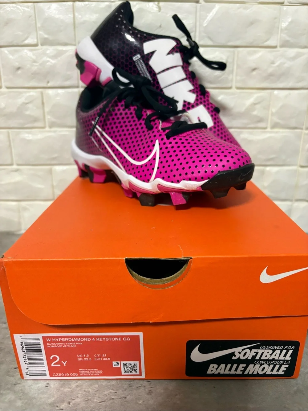 Nike Kids' Pink and Black Softball Cleats with White Swoosh